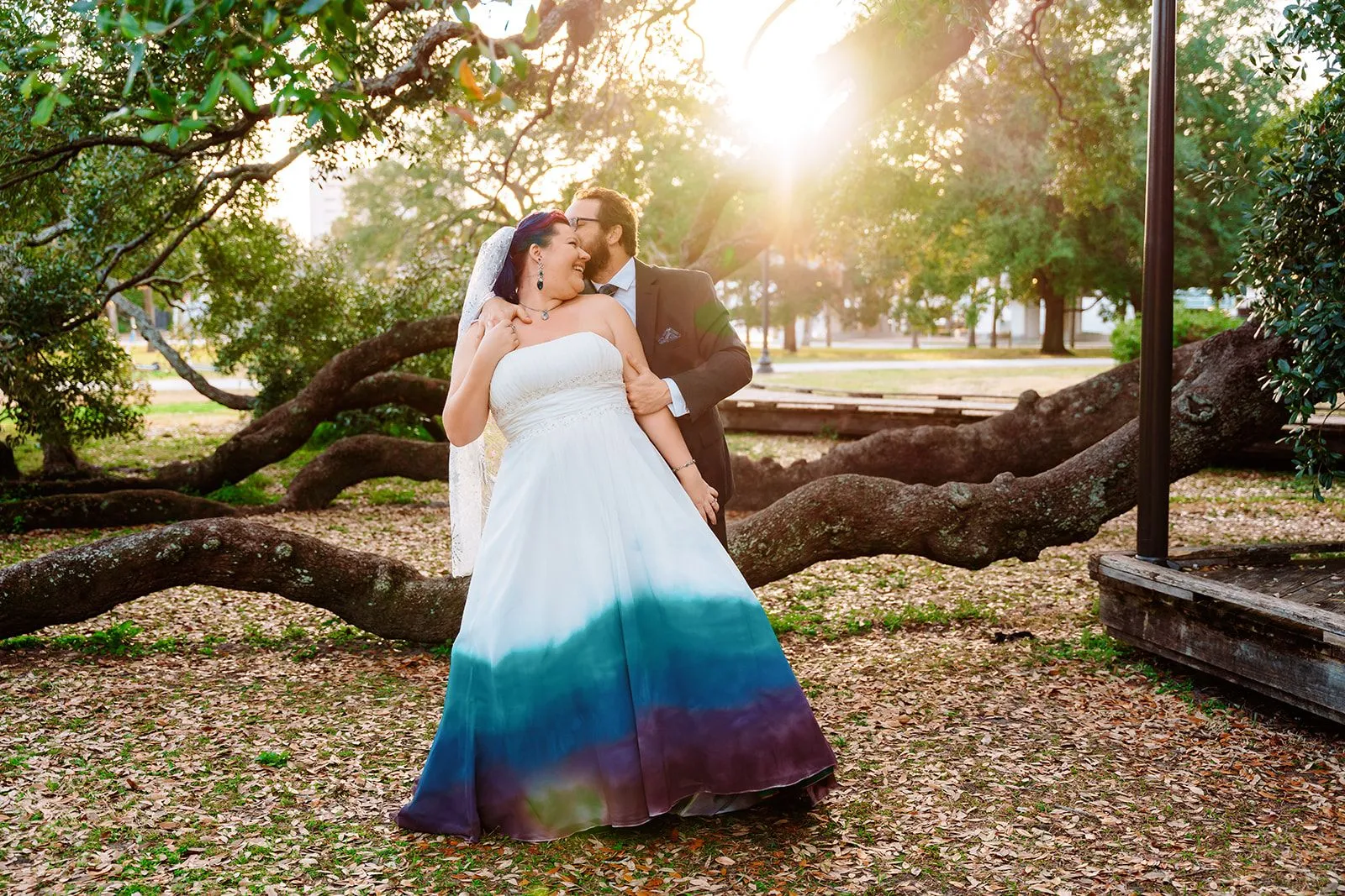 Couple sharing a dip beneath the oak trees