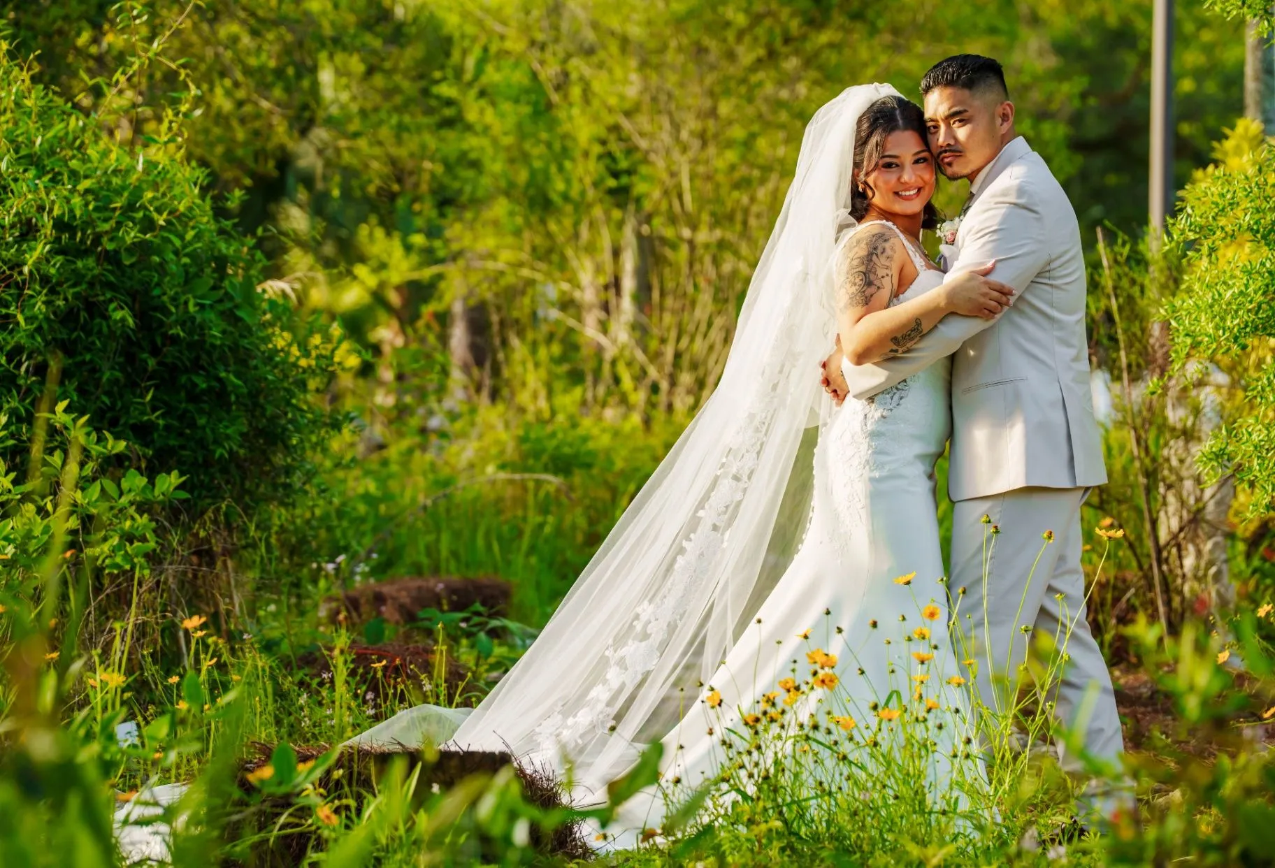 Couple standing together in a green garden